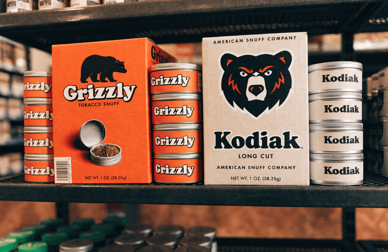 The Grizzly and Kodiak logos shown side-by-side under the umbrella of the American Snuff Company logo.